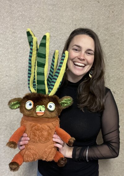 Natalie holding artistic stuffed creature
