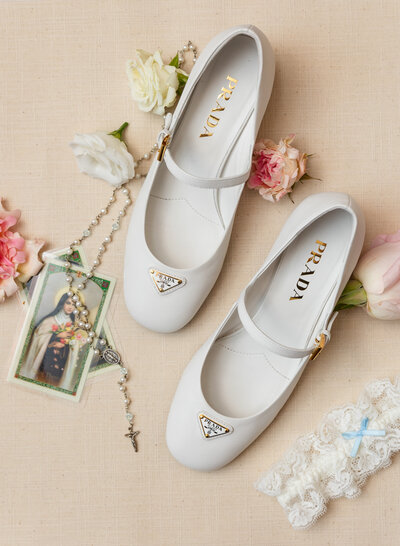 prada shoes in a Catholic flat lay