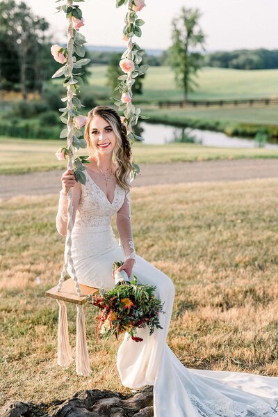 Bride on swing decorated with florals