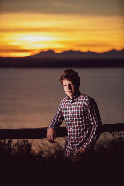 seattle senior portrait photographer captures student with olympic mountains for yearbook photo