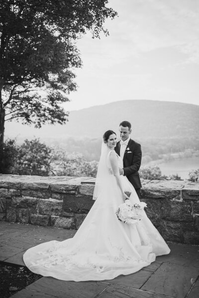 black and white photo of a bride and groom posing after wedding ceremony