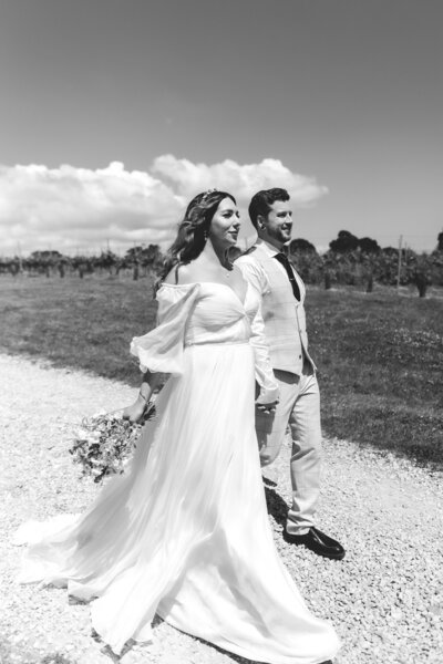 BRIDE AND GROOM BASK IN THE SUNLIGHT AT THEIR ELOPEMENT AT THE BRICKHOUSE VINEYARD IN DEVON