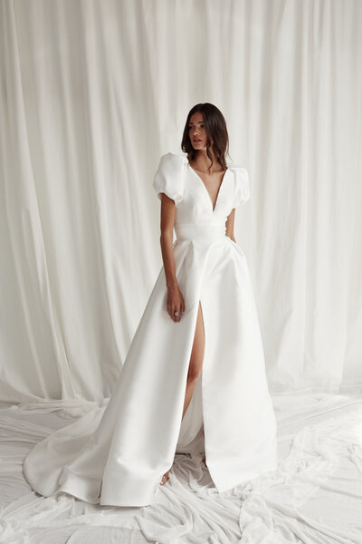 black and white image bride wearing feathered wedding dress