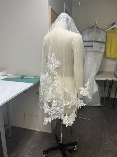 a custom lace veil after completion shown from the side