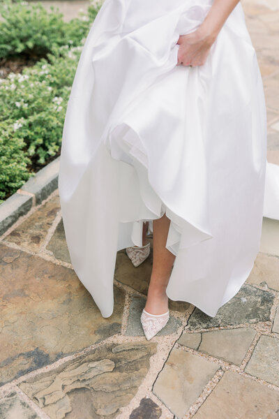 bride walking in wedding shoes at Fort Worth Botanic Gardens wedding by Kortney Boyett Photography, Fort Worth wedding photographer