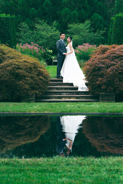 bride and groom posing during sunset