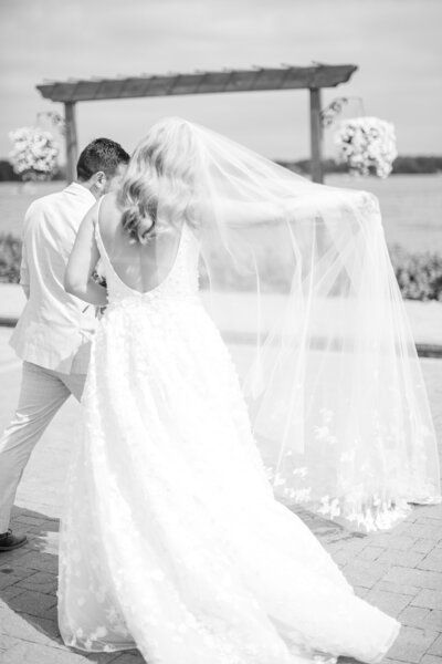 Brides veil blowing in the wind at Lake Lawn Resort Delevan Wisconsin
