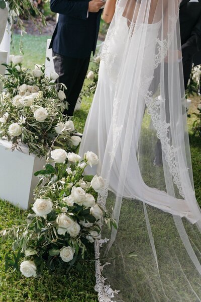Wedding details with bride veil and floral arrangement taken by east coast photographers Shelby Ann Photos