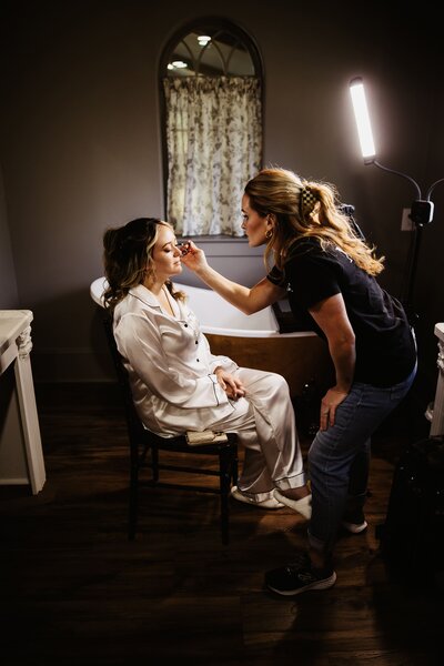 A Houston bride-to-be receiving a customized bridal beauty consultation from a top Houston makeup artist at Muse in Houston, TX.