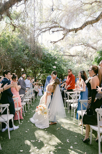 Wedding ceremony at Green Gables in San Diego, California, featuring an outdoor ceremony with a scenic backdrop and guests in attendance.
