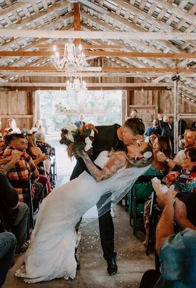 couple at wedding kissing