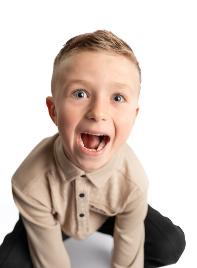 Young boy making funny face at the camera