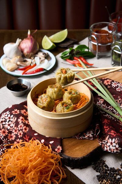 yummy thai dumplings being held in chopsticks. example of richmond va food photography