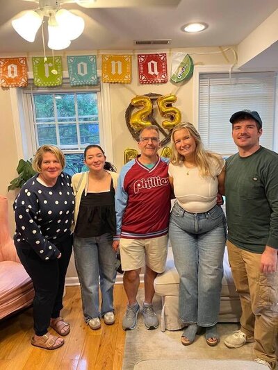 Part of the Leardi Family smiling with Cinco de Mayo decorations. 