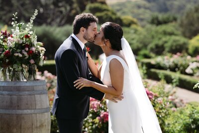 Bride and groom sharing a kiss at sunset on the beautiful Mornington Peninsula, captured by Carry Your Heart Photography. The golden light adds a romantic touch to this intimate moment.