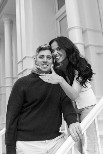 black and white photo of a happy engaged couple 