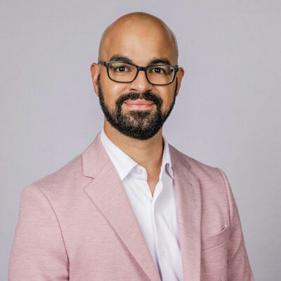 Jonathan Santiago, Director of Business Development gives Marcia an energetic testimonial. 