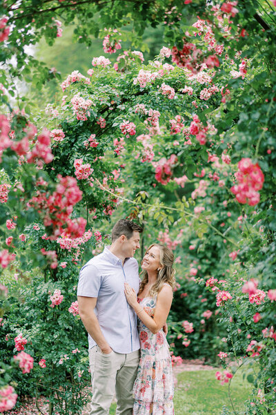 A couple at their floral engagement at Longwood Gardens in Kennett Square, PA