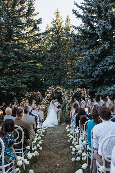 A couple dances at their wedding surrounded by Anthousai floral installations and arrangements at Spain Ranch in Tulsa.
