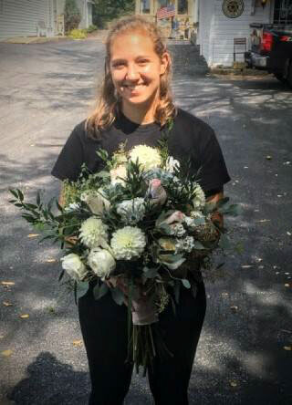 Pittsburgh wedding florist Heavenly Blooms holding large floral bouquet