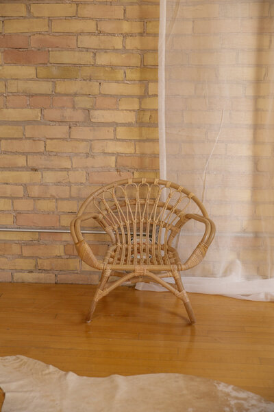 A child size rattan chair.