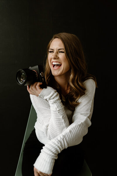 Photographer smiling at potential clients