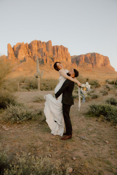 st louis wedding photos of bride and groom holding each other in the desert