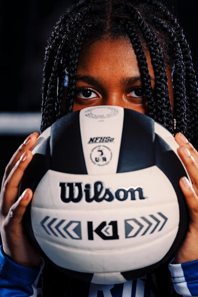 Senior Volleyball Player Holding Ball