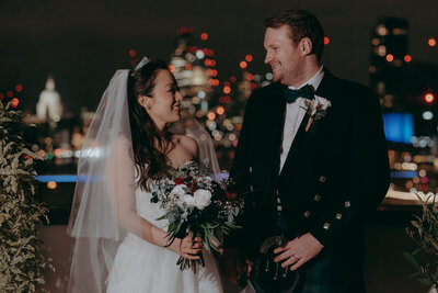 Bride and Groom Wedding Portrait on the roof at Corinthia Hotel with Nighttime Views of the London skyline behind