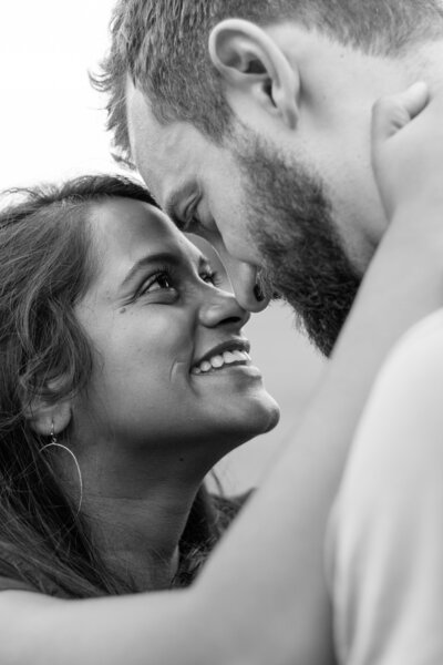 Closeup of bride and groom looking at each and smiling