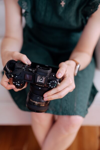 close up of Carrie holding a camera