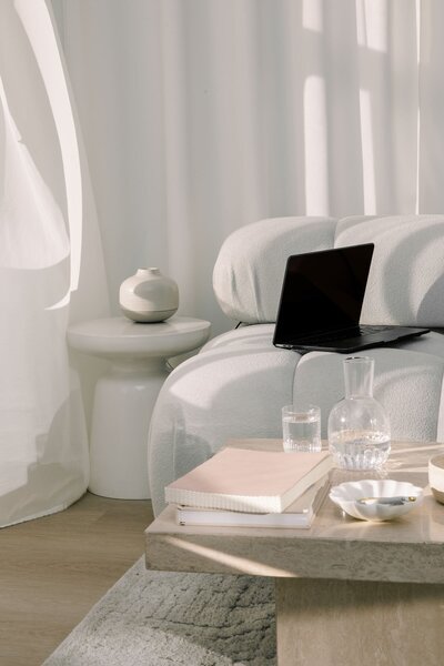 Holistic-inspired living room corner with a minimalist design and layered neutrals