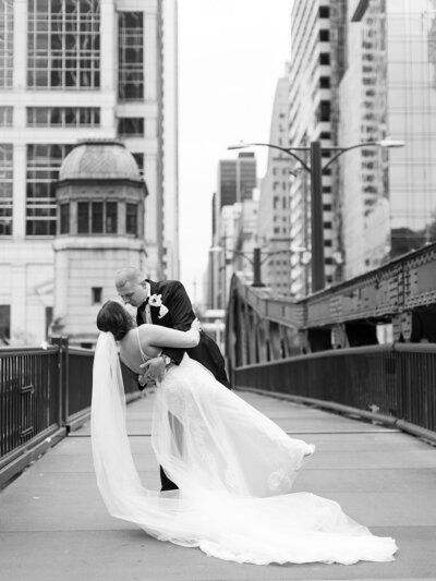 bride and groom in chicago on their wedding day, holding each other