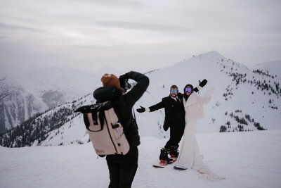 Adventure elopement photographer taking a picture of a couple