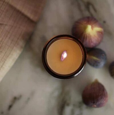 candle burning on marble countertop