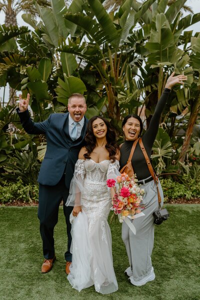 photographer posing with couple