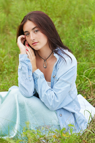 jean jacket sitting in grass