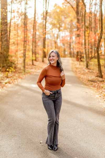photographers in gatlinburg tn headshot with photographer posing on a path in the mountains during the fall 