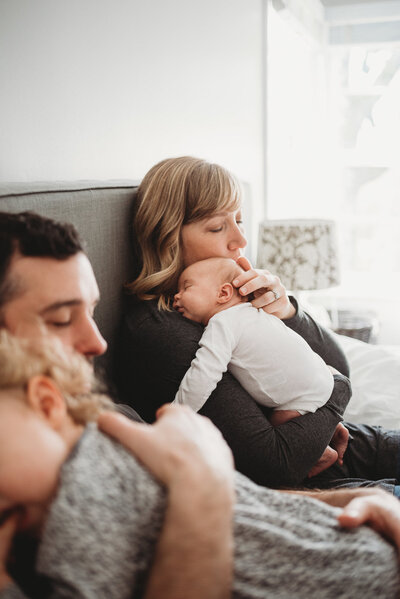 mom with newborn in bed