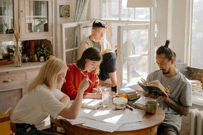 group of college kids working at a table