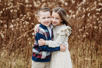 brother and sister cuddling by lancaster pa family photographer