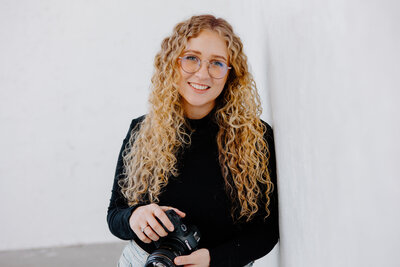 Professional portrait of Natalie Dyer, founder of Natalie Dyer Photo, looking confidently at the camera.