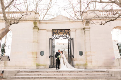 Bride and Groom portrait outside a pillar in Bensalem