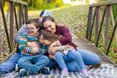 professional potrait of dad, mom and  toddler boy in Chicago-area fall family mini session