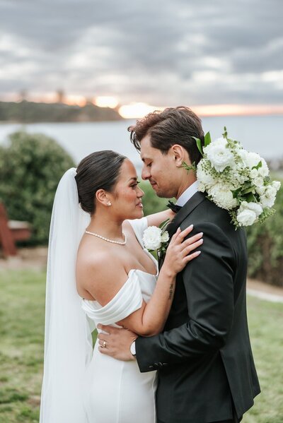 Bride and groom getting married outside at the beach