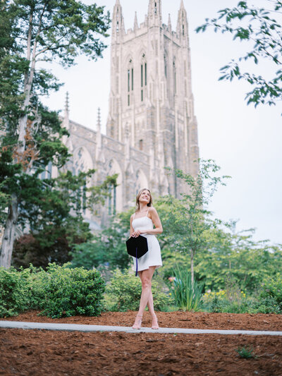 A Duke Law student in front of Duke Chapel