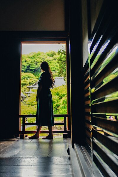 kacy beck in the doorway of a temple in kamakura