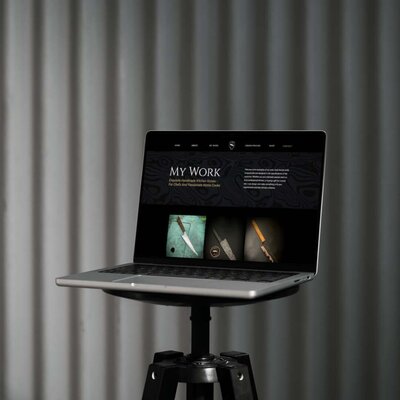 laptop on a stand showing website redesign for small business cuttlebrook knives