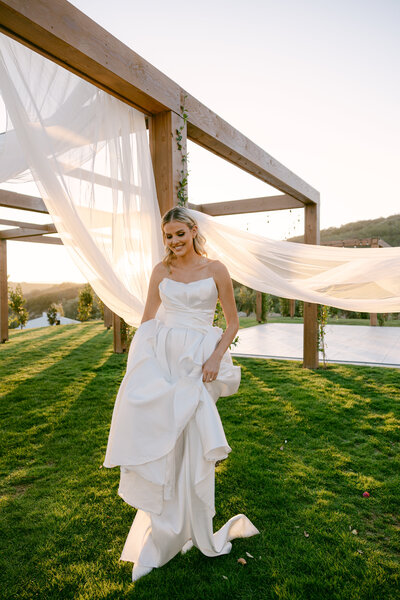 Bride poses for a photo at Jeune Perche Wedding Venue in Fallbrook, CA.