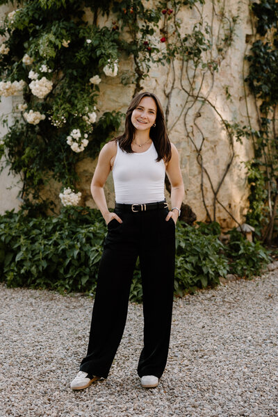 A person standing with their hands in their pockets